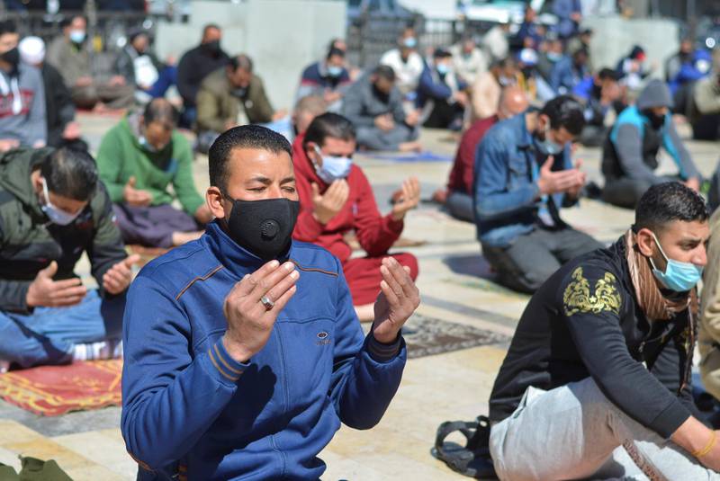 Men wearing protective face masks attend Friday prayers at al-Husseini mosque, as Jordan announced stricter measures to curb the spread of the coronavirus disease (COVID-19), in Amman, Jordan February 26, 2021. REUTERS/Muath Freij      NO RESALES. NO ARCHIVES