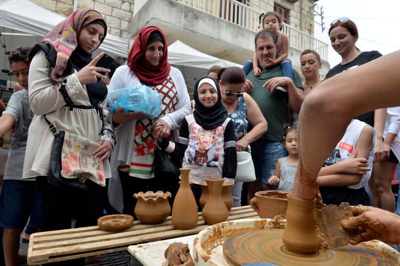 A laborer works at a traditional clay pots during Cherry Day in the village of Hammana, southeast of Beirut, Lebanon.  EPA