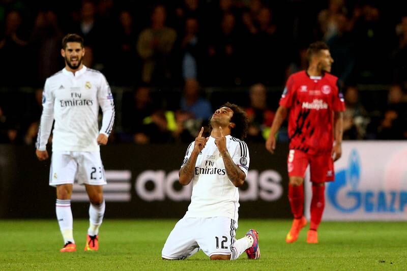 Marcelo celebrates his team's victory in the Uefa Super Cup in 2014. Getty