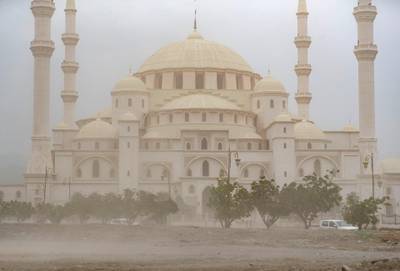 Fujairah, United Arab Emirates - Reporter: N/A: Weather. A dust storm passes by the Sheikh Zayed Mosque in Fujairah. Wednesday, April 15th, 2020. Fujairah. Chris Whiteoak / The National