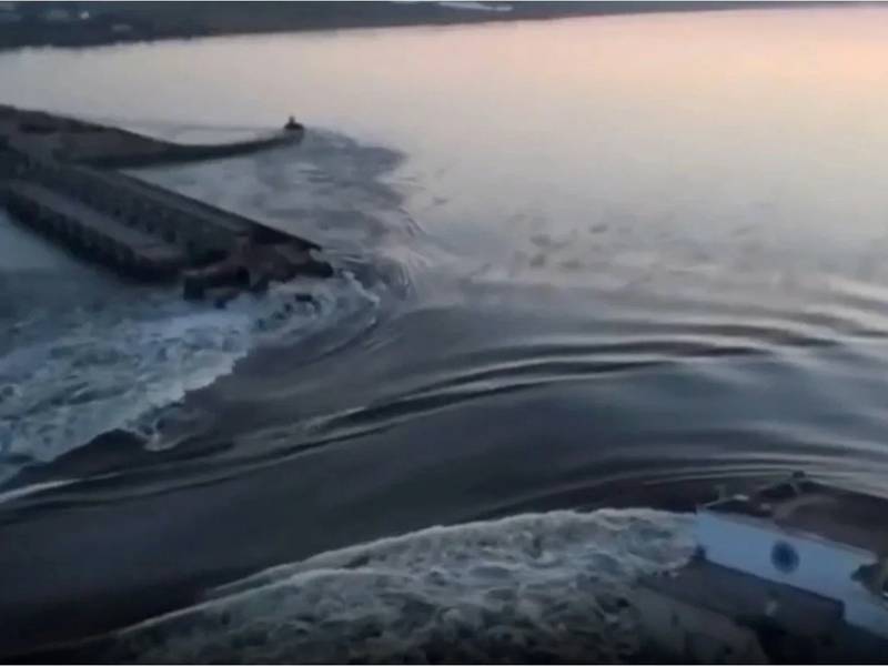 Water runs through a breach in the Kakhovka dam. AP