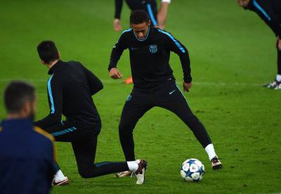 Barcelona’s Neymar dribbles the ball during training on Tuesday ahead of the team’s Champions League contest. Patrik Stollarz / AFP