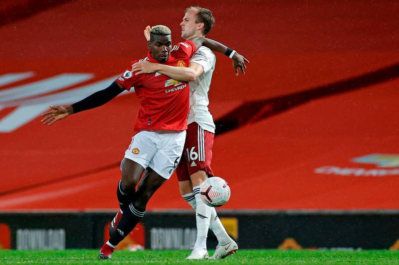 United's Paul Pogba attempts to escape the attentions of Arsenal defender Rob Holding. AFP