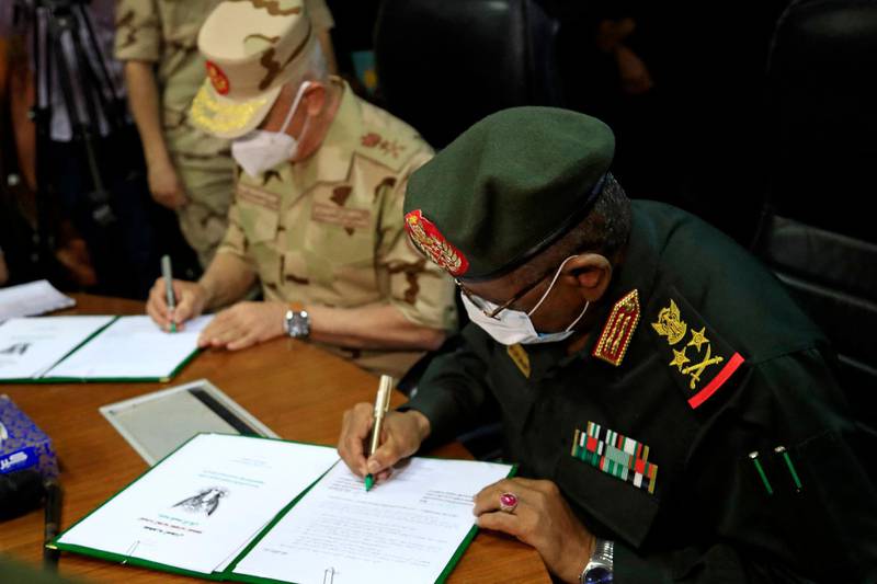 Egyptian military Chief of Staff Mohamed Farid and his Sudanese counterpart Mohamed Othman al-Hussein sign a bilateral agreement during a meeting of the Egyptian-Sudanese military committee, in Sudan's capital Khartoum. AFP