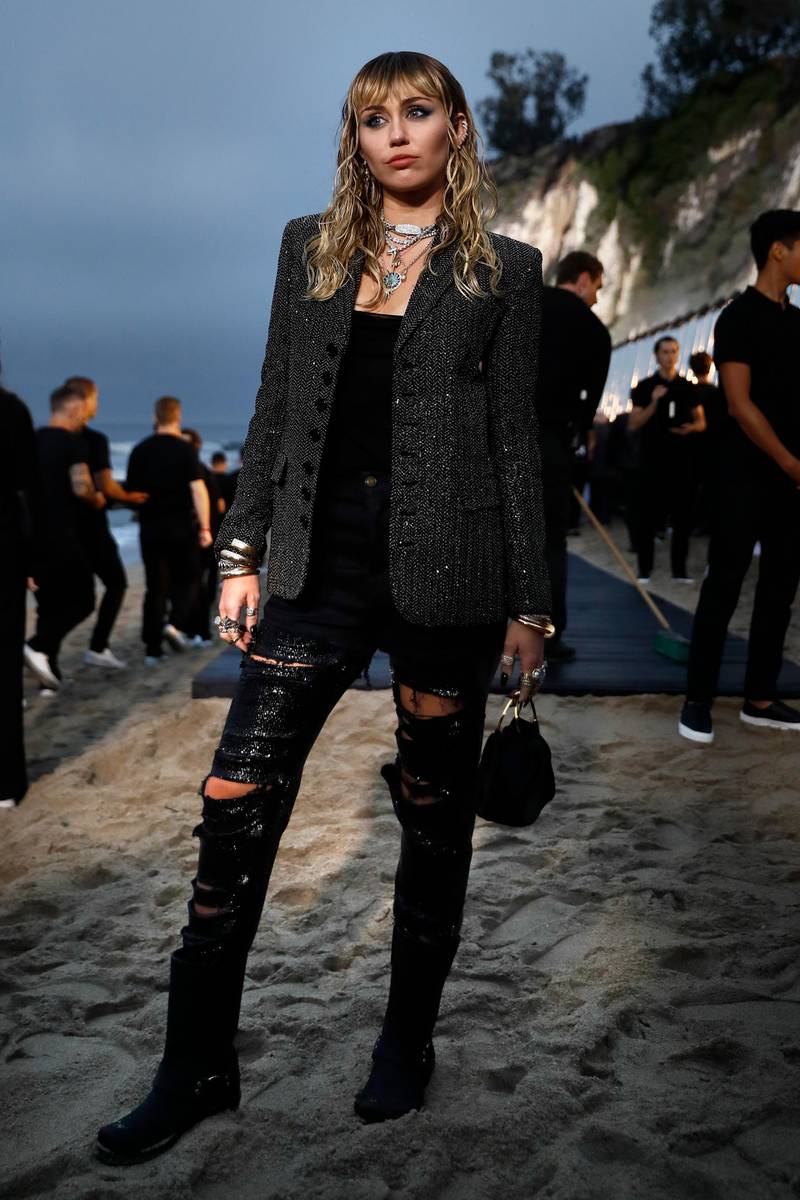 epa07631852 US singer Miley Cyrus arrives to attend the Spring/Summer 2020 Menswear collection show by Belgian designer Anthony Vaccarello for Saint Laurent Paris fashion house in Malibu, California, USA, 06 June 2019.  EPA-EFE/ETIENNE LAURENT