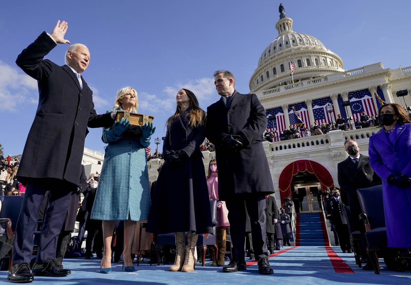 Joe Biden is sworn in as the 46th President of the United States by Chief Justice John Roberts as Jill Biden holds the Bible in Washington last year. AP Photo