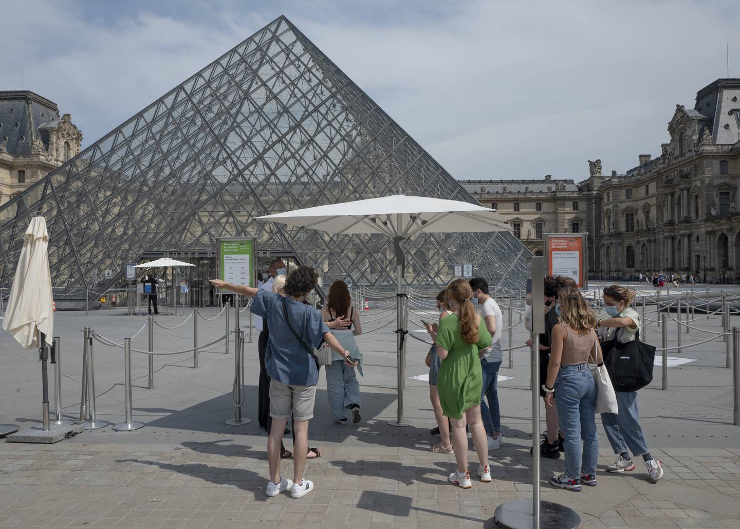 Visitors enter after registering for Covid-19 tests at the Louvre museum in Paris, France. AP 