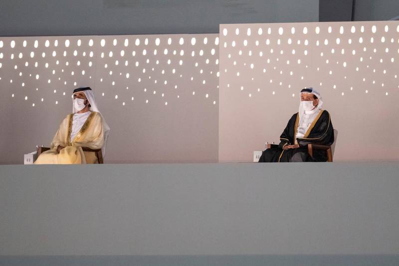 Sheikh Mohammed bin Rashid, Vice President and Ruler of Dubai, and Sheikh Humaid bin Rashid Al Nuaimi, Ruler of Ajman, attend the 'Seeds of the Union' National Day show in Abu Dhabi. Courtesy: Sheikh Mohamed bin Zayed Twitter