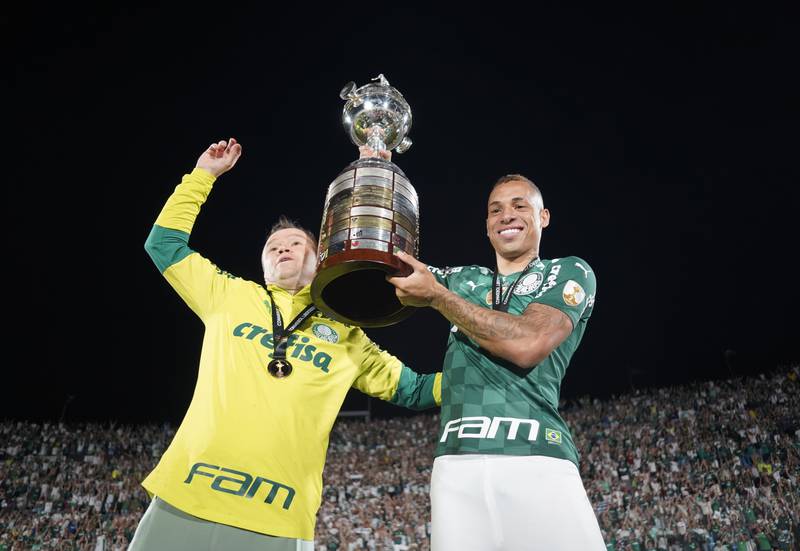 Palmeiras' Breno Henrique celebrates winning the Copa Libertadores with the trophy. Reuters
