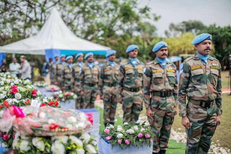 United Nations personnel during a ceremony to pay tribute to UN peacekeepers killed during a protest in Butembo in Goma, Democratic Republic of Congo. EPA 