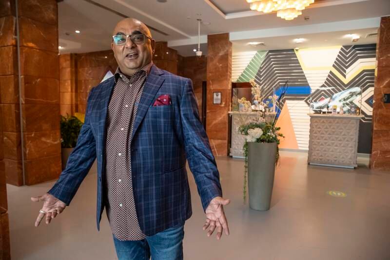 Owner JS Anand is proud of his unusually designed hotel and believes its location is another factor behind its success, despite being in one of the city’s older buildings. Antonie Robertson / The National
