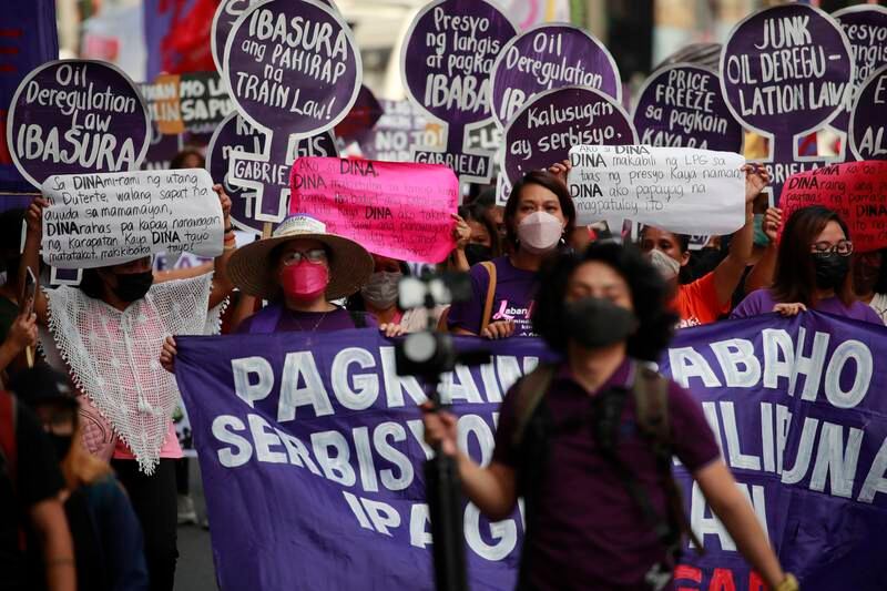 Protesters during a march to mark International Women's Day in Manila, Philippines.  The protesters urged warring nations to look into problems caused globally by the latest Russia-Ukraine war.  EPA
