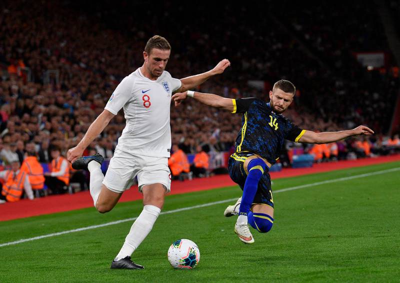 England's Jordan Henderson and Kosovo's Valon Berisha in action. EPA