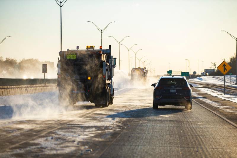 Snow ploughs clear a lane of the  I-30 motorway in Dallas. The Nashville Predators and the Dallas Stars NHL hockey game on Monday was postponed at the request of Dallas Mayor Eric Johnson owing to a power shortage. AP