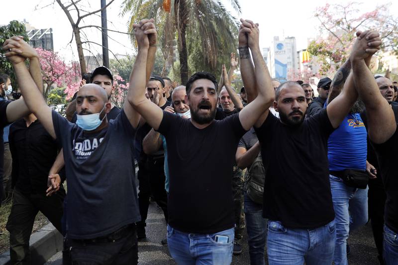 Demonstrators chant slogans against Judge Tarek Bitar, who is investigating last year's deadly Beirut port blast.  AP