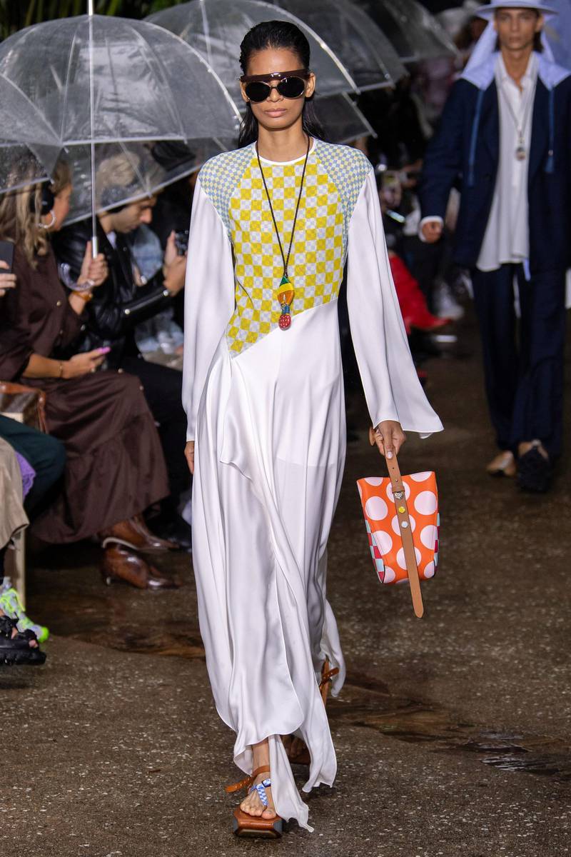 Contrasting patterns worn over a simple jersey dress and long necklace at Lanvin, spring summer 2020
