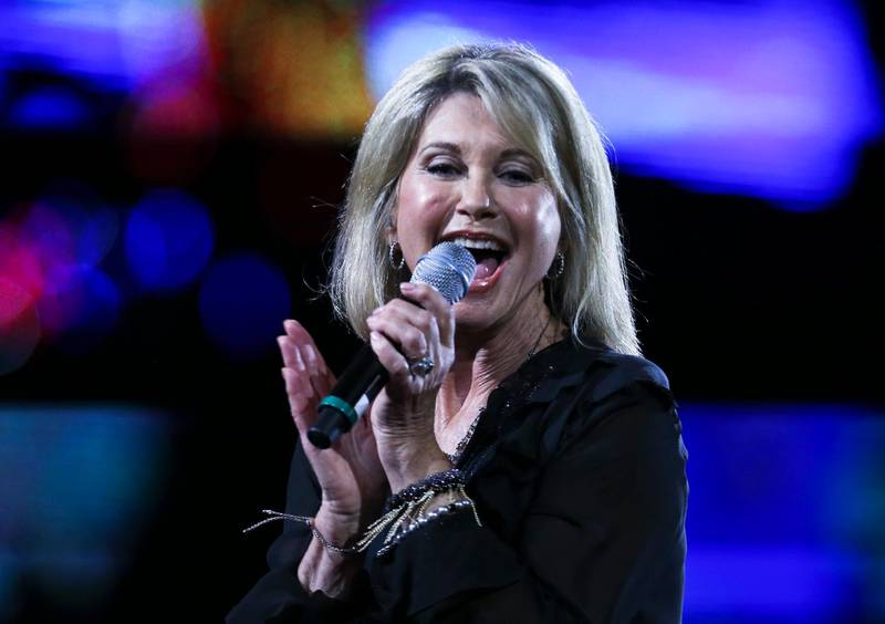 Olivia Newton-John was made a dame — the female equivalent of a knight — for her singing and acting and also for her charitable work supporting cancer research. AP
