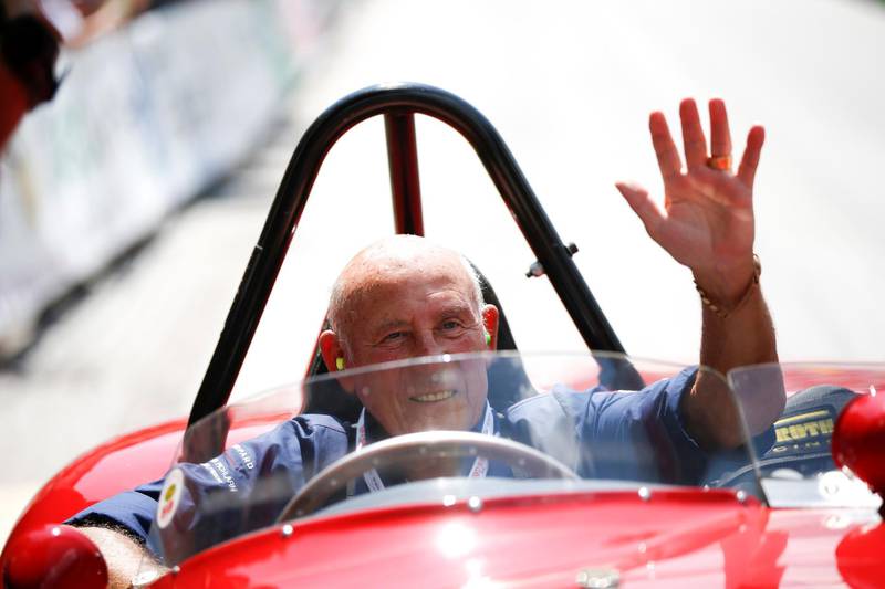 Stirling Moss waves to spectators as he sits in his 1955 Ferrari 750 Monza during the Ennstal Classic rally near the Austrian village of Groebming on July 20, 2013. Reuters