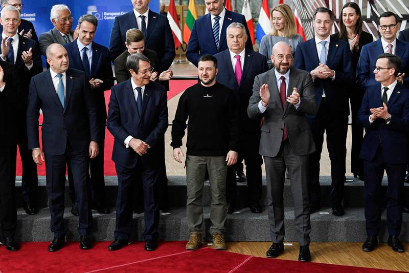 Mr Zelenskyy is applauded by President of the European Council Charles Michel and EU leaders. AFP