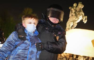 A policeman detains a young demonstrator during a protest against Russia's attack on Ukraine in St Petersburg, Russia. AP