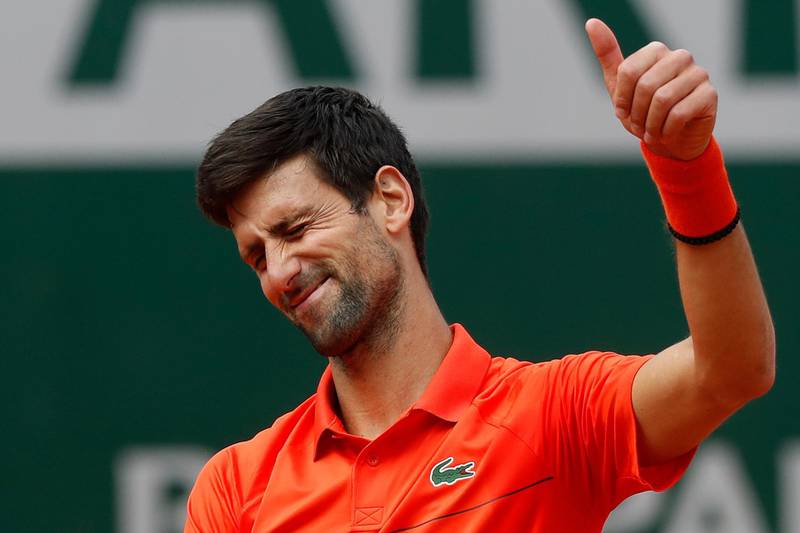 Serbia's Novak Djokovic flashes a thumbs up as he celebrates winning his first round match of the French Open tennis tournament in three sets 6-4, 6-2, 6-2, against Poland's Hubert Hurkacz at the Roland Garros stadium in Paris, Monday, May 27, 2019. (AP Photo/Pavel Golovkin)