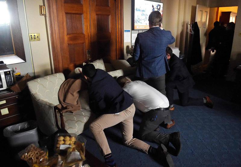 Congress staffers barricade themselves after Trump supporters stormed inside the US Capitol. AFP