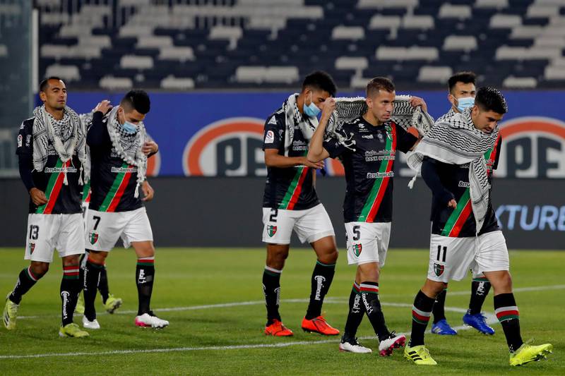 Players of Chile's Club Deportivo Palestino wear keffiyeh, to show support for the Palestinian people, before their match against Colo Colo in Santiago. EPA