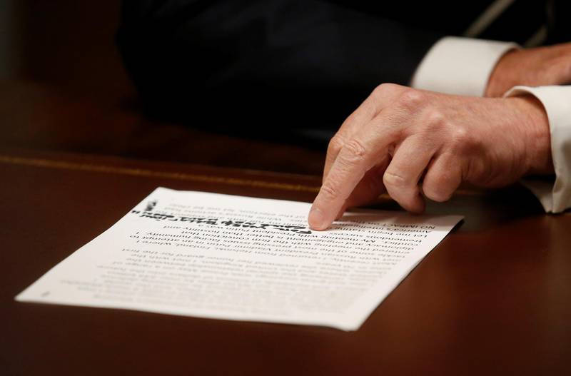 Donald Trump reads from his notes. Reuters