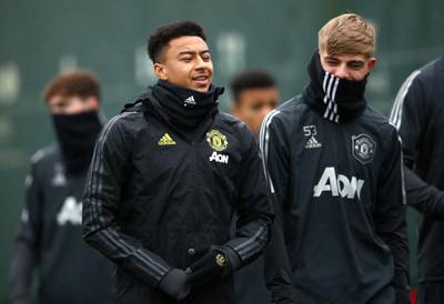 Jesse Lingard wraps up for the training session ahead of their game against Partizan on Thursday. PA