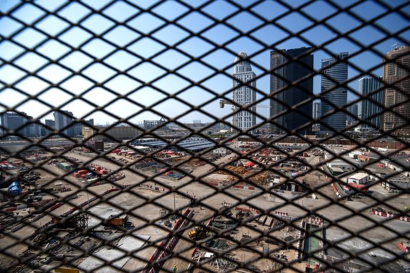 A view of Dubai through safety mesh on the site.