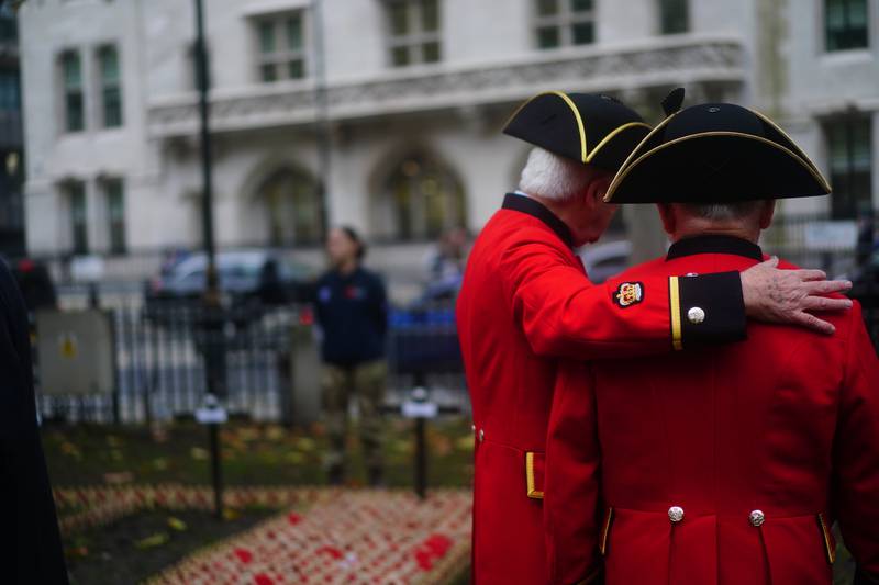 Chelsea Pensioners at a display of messages and crosses at the Field of Remembrance. PA
