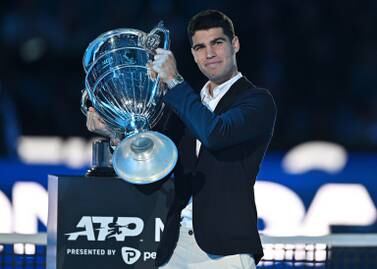 Carlos Alcaraz of Spain receives the trophy for finishing the ATP's year ranking on first place, during the ATP Finals 2022 in Turin, Italy, 16 November 2022.  Alcaraz in September 2022 become the youngest world number one in the ATP singles ranking's history.   EPA / Alessandro Di Marco