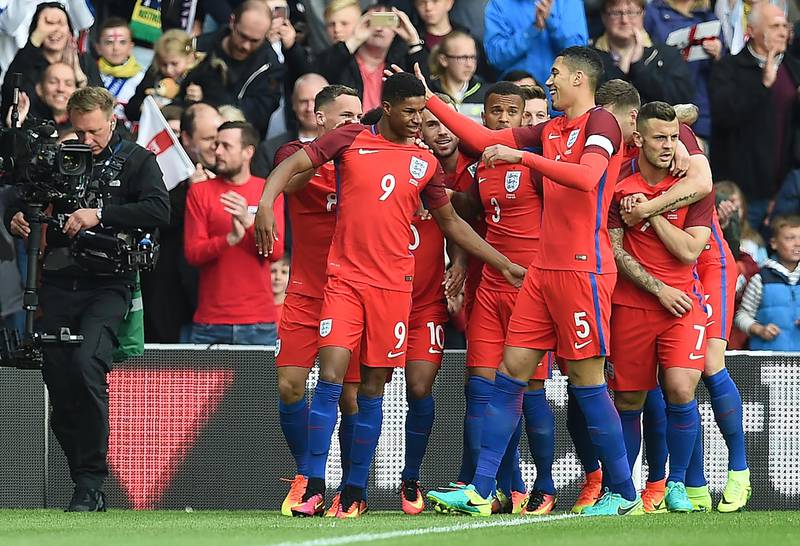 England's striker Marcus Rashford (C) celebrates after scoring his team's first goal during the International friendly football match between England and Australia at the Stadium of Light in Sunderland, north east England, on May 27, 2016. (Photo by PAUL ELLIS / AFP) / NOT FOR MARKETING OR ADVERTISING USE / RESTRICTED TO EDITORIAL USE
