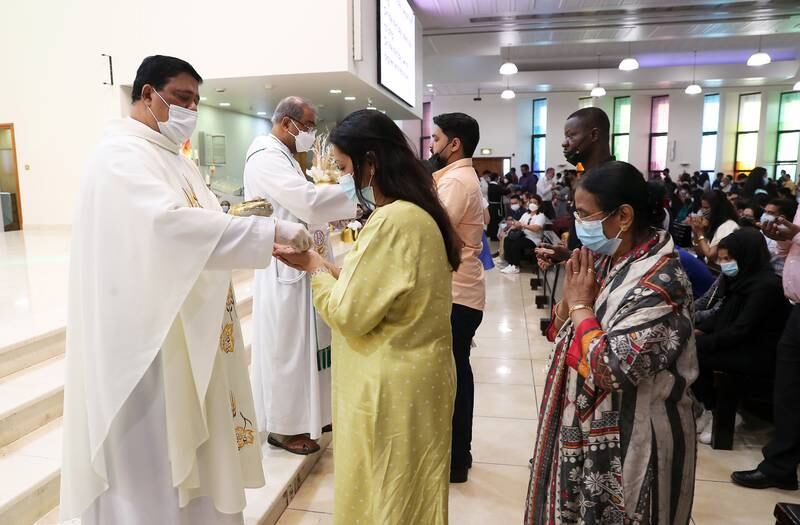 Father Andre during the Easter Sunday mass held at St. Mary's Catholic Church in Dubai. Pawan Singh / The National