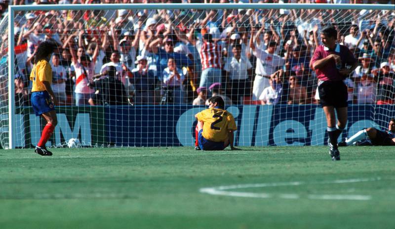 LOS ANGELES, UNITED STATES - JUNE 22: Andres Escobar (C) of Colombia reacts after scoring an own goal during the World Cup group A match between USA and Colombia on June 22, 1994 in Los Angeles, United States. (Photo by Michael Kunkel/Bongarts/Getty Images)