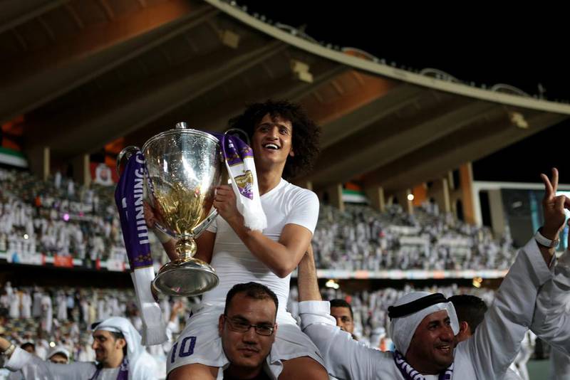 Omar Abdulrahman of Al Ain holds the President's Cup trophy aloft. Christopher Pike / The National / May 18, 2014