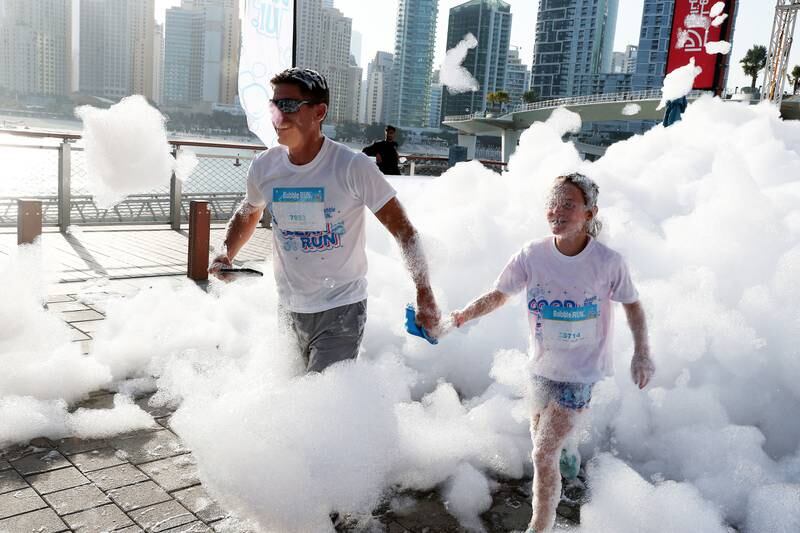 Participants in the bubble run held at The Plaza on Bluewaters Island in Dubai. Pawan Singh / The National