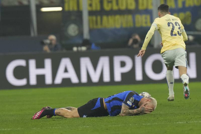 Inter Milan's Federico Dimarco lies on the pitch. AP