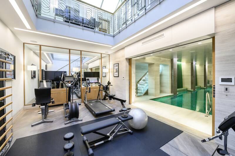 A double-height atrium with a glass ceiling floods the basement gym with light.  Photo: Wetherell/Darran Mulcahy Photography