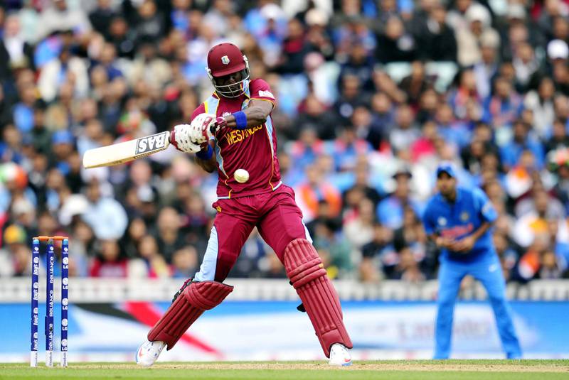 West Indies' Darren Sammy bats during the 2013 ICC Champions Trophy cricket match between India and West Indies at The Oval in London on June 11, 2013. AFP PHOTO/GLYN KIRK  == RESTRICTED TO EDITORIAL USE  ==
 *** Local Caption ***  317640-01-08.jpg