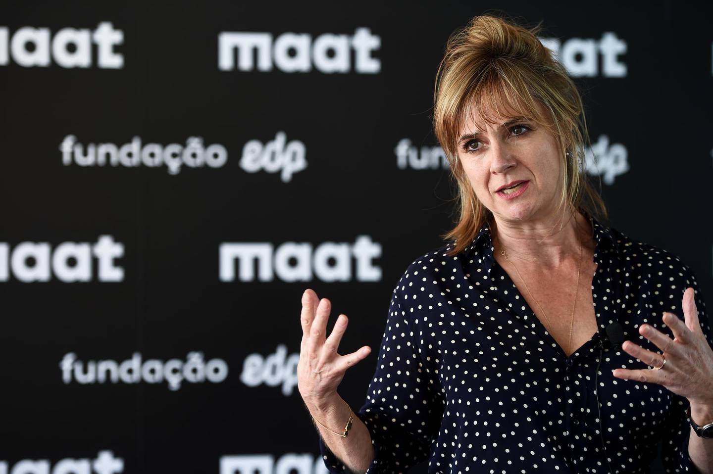 The architect of the MAAT museum ((Museum of Art, Architecture and Technology) Amanda Levete gives a press conference during a boat ride on the Tagus River in Lisbon on October 3, 2016. - The MAAT museum will open for public on October 5, 2016. (Photo by PATRICIA DE MELO MOREIRA / AFP)