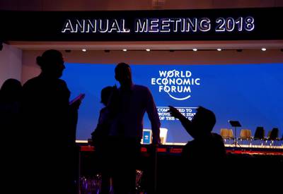Staff talk in the Congress Hall ahead of the World Economic Forum (WEF) annual meeting in the Swiss Alps resort of Davos, Switzerland. Denis Balibouse / Reuters