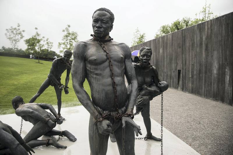 MONTGOMERY, AL - APRIL 26: A sculpture commemorating the slave trade greets visitors at the entrance National Memorial For Peace And Justice on April 26, 2018 in Montgomery, Alabama. The memorial is dedicated to the legacy of enslaved black people and those terrorized by lynching and Jim Crow segregation in America. Conceived by the Equal Justice Initiative, the physical environment is intended to foster reflection on America's history of racial inequality.   Bob Miller/Getty Images/AFP