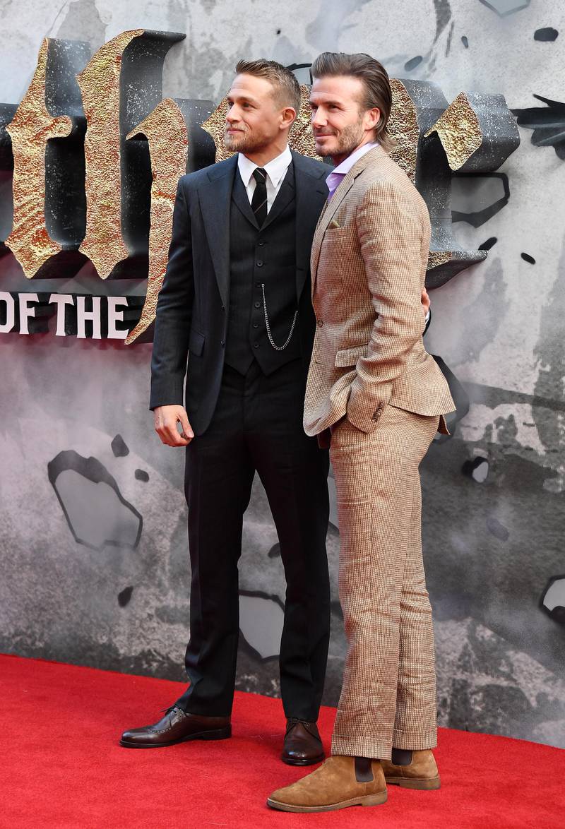 epa05955587 British actor Charlie Hunnam (L) and British former soccer player David Beckham pose on the red carpet during the European film premiere of 'King Arthur: Legend of the Sword' at Leicester Square in London, Britain, 10 May 2017.  EPA/ANDY RAIN