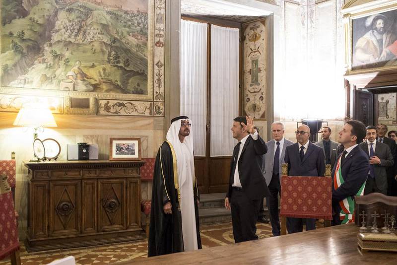 Matteo Renzi, Prime Minister of Italy, second left, shows Sheikh Mohammed bin Zayed, Crown Prince of Abu Dhabi and Deputy Supreme Commander of the Armed Forces, left, the Mayor of Florence’s office prior to a meeting at Museo di Palazzo Vecchio. They are seen with Dario Nardella Mayor of Florence, right. Ryan Carter / Crown Prince Court - Abu Dhabi