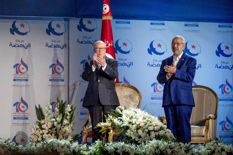 Tunisian president Beji Caid Essebsi and president of Ennahda movement Rached Ghannouchi stand on stage during the 10th general assembly of Ennahda Party at Olypmic Hall in Rades, Tunisia on May 20, 2016. Nicolas Fauque / Sipa USA