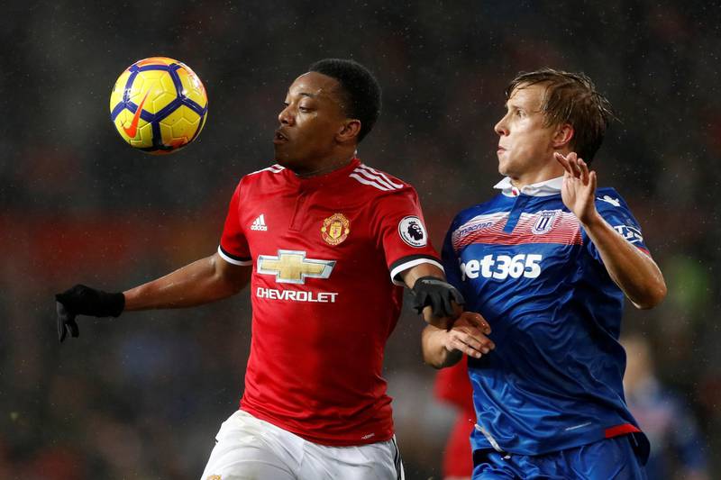 Soccer Football - Premier League - Manchester United vs Stoke City - Old Trafford, Manchester, Britain - January 15, 2018   Manchester United's Anthony Martial in action with Stoke City’s Moritz Bauer     Action Images via Reuters/Carl Recine    EDITORIAL USE ONLY. No use with unauthorized audio, video, data, fixture lists, club/league logos or "live" services. Online in-match use limited to 75 images, no video emulation. No use in betting, games or single club/league/player publications.  Please contact your account representative for further details.