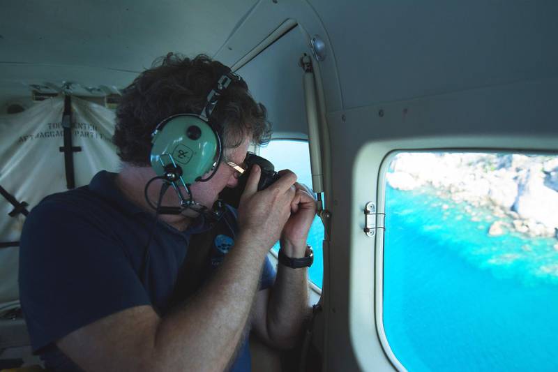 This undated handout photo received on April 6, 2020 from the ARC Centre of Excellence for Coral Reef Studies at James Cook University, shows professor Terry Hughes conducting an aerial survey of coral bleaching on the Great Barrier Reef.  AFP