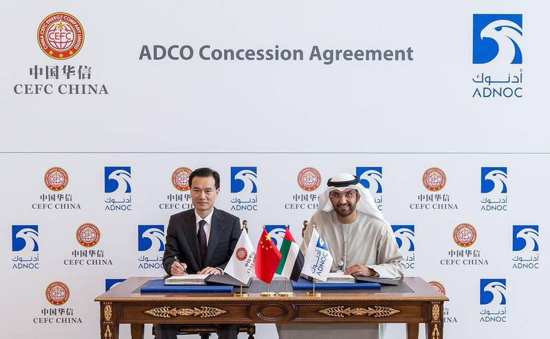 Above, Adnoc chief executive Sultan Al Jaber and CEFC chairman Ye Jianming during the signing of the agreement. Courtesy Adnoc