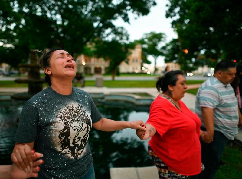 People pray during a vigil for the victims of a mass shooting at Robb Elementary School in Uvalde, Texas. AP